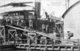 Singapore: A ship discharging coal, c.1900.
